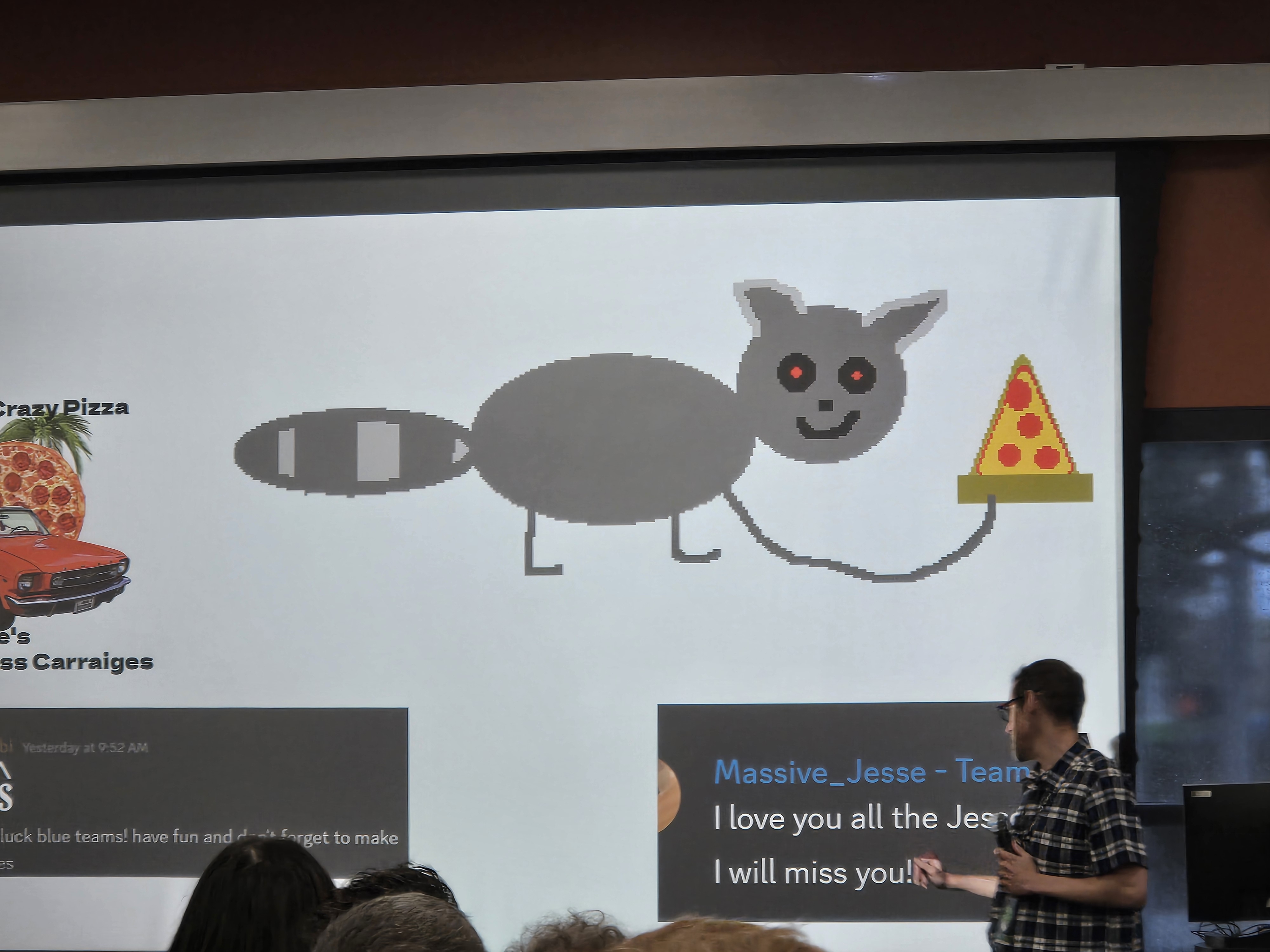 Picture of our raccoon artwork on the black team’s slides.